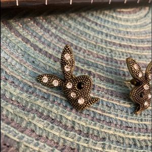 Playboy post earrings.  Brass color w/ rhinestones